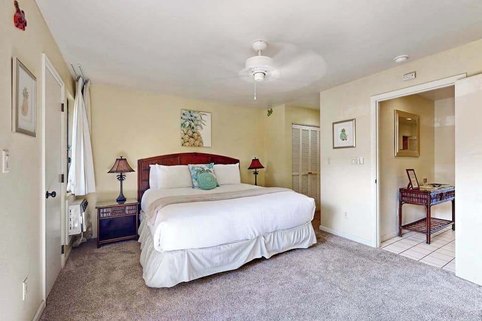 Restful bedding beneath bright ceilings and daylight