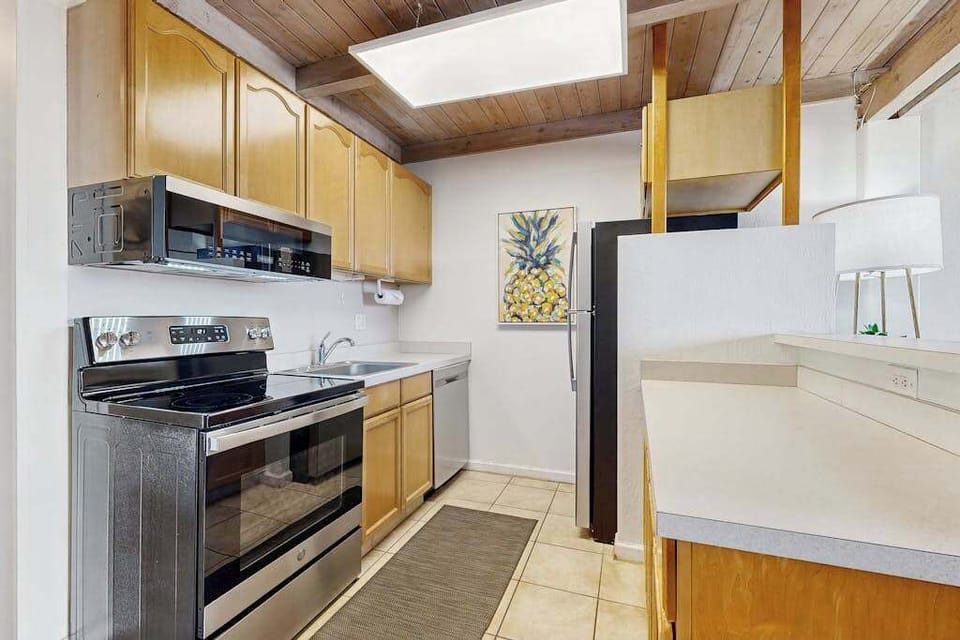 Fully stoked kitchen with stainless steel appliances.