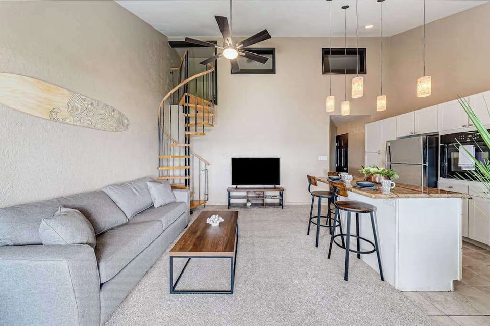Bright open-concept living room with vaulted ceilings