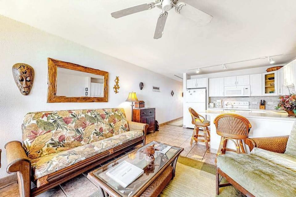 Bright living room with sliding glass doors, abundant natural light and flatscreen tv.
