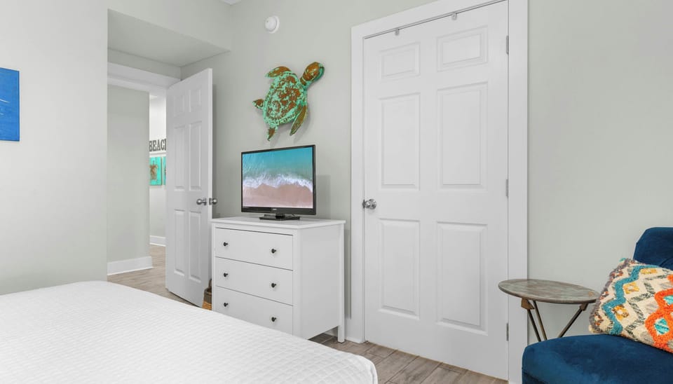 Bedroom 2 with queen bed, Smart TV, and shared ensuite 