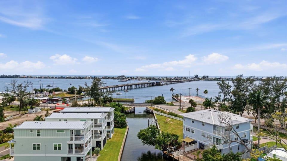 Spectacular aerial view of the bay and Cortez Bridge, with the property visible below - a reminder of just how close to the water this home truly sits.