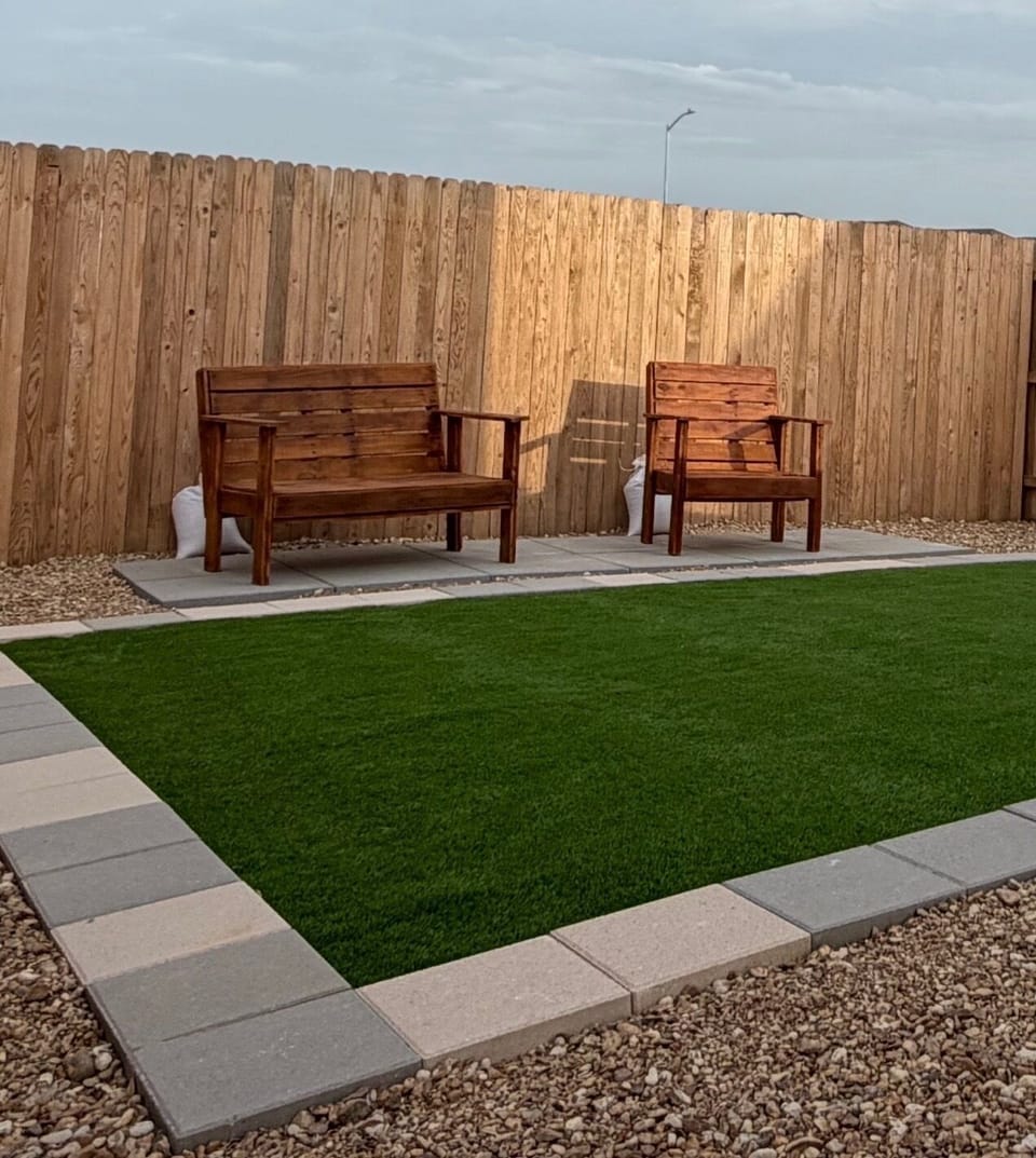Love seat wooden bench , wooden chair and artificial grass area