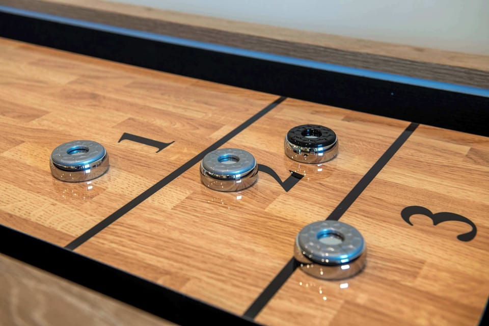 Keep score, trash talk freely, and stay in the game — the shuffleboard table is the centerpiece of hours you won't want to end.