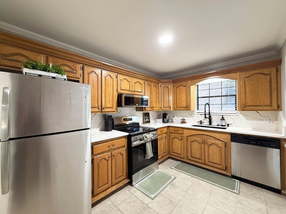 Spacious full kitchen with stainless appliances and ample counter space