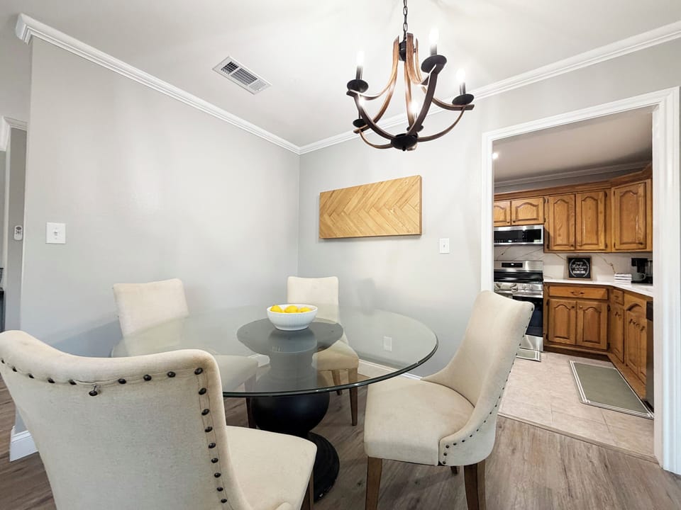 Bright, stylish dining nook beside a fully equipped kitchen