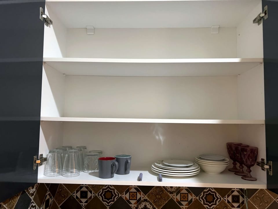 Plates, bowls, mugs, and glassware provided.