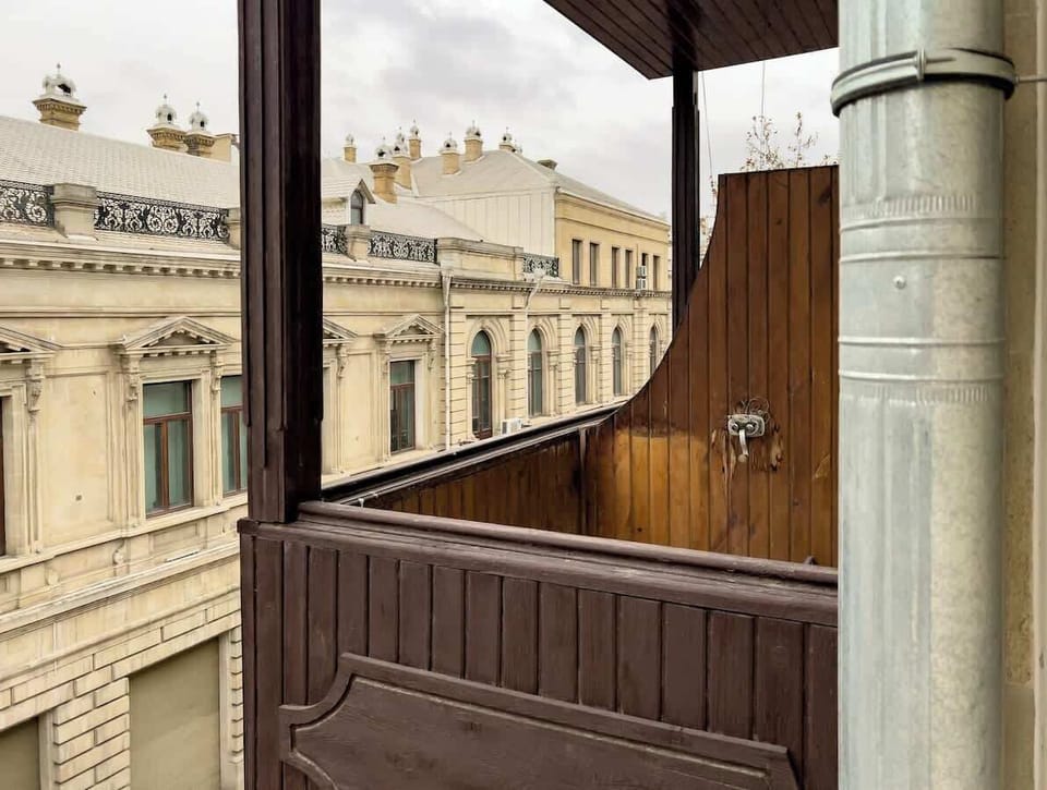 Wooden balcony with a Caspian Sea view and partial Formula 1 route view.