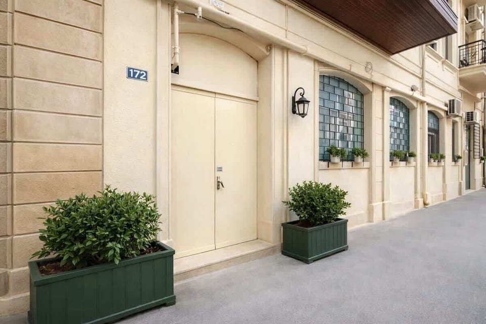 Ground-floor entrance on a quiet residential lane.