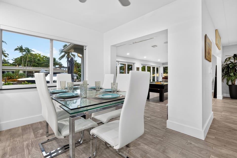 Dining area with canal views and easy flow into the game room.