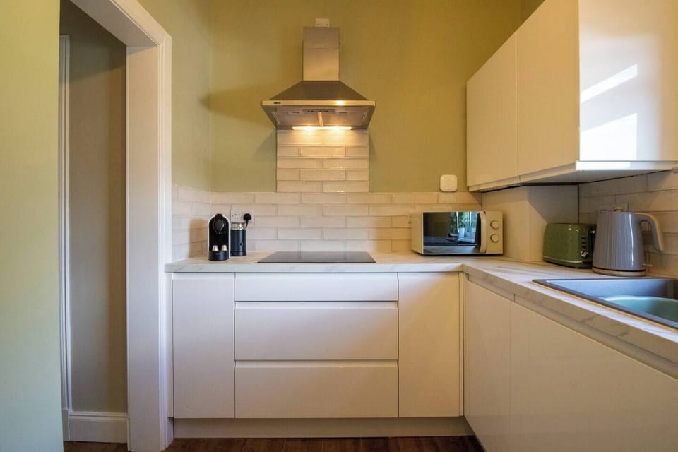 Whether you're making a quick breakfast or a family dinner, this thoughtfully equipped kitchen has everything needed for a comfortable stay.
