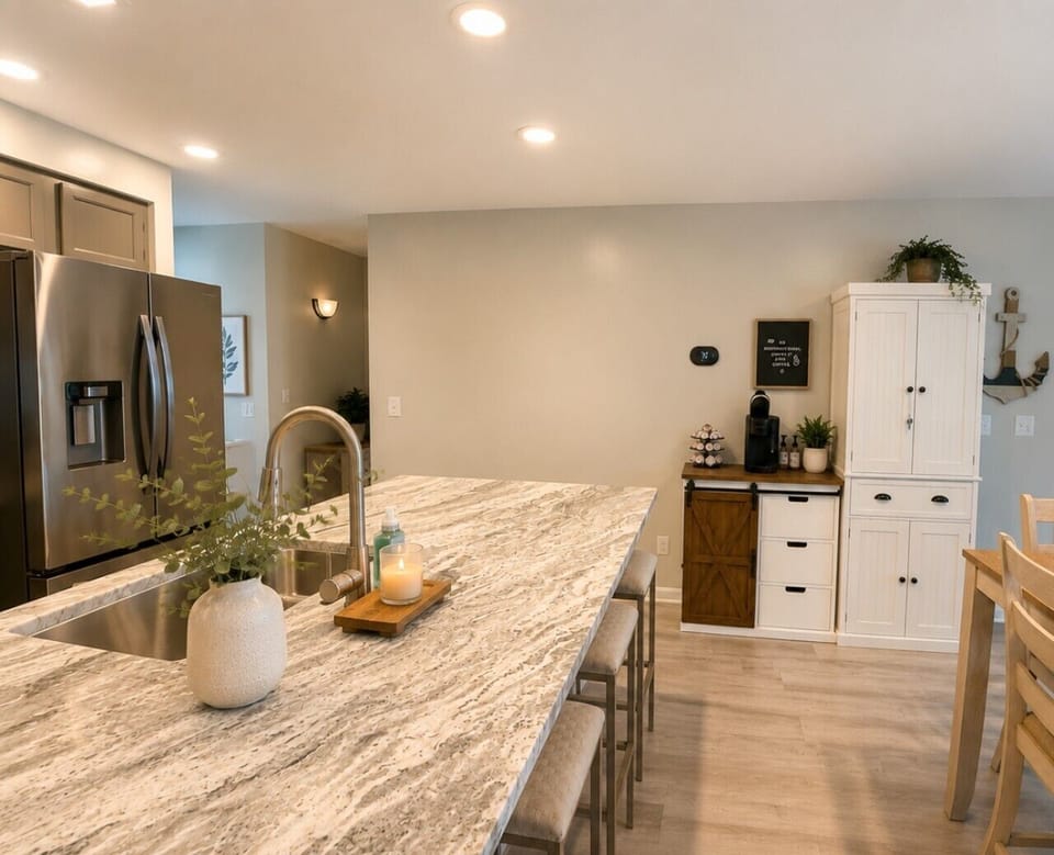 Fully equipped gourmet kitchen with granite countertops, stainless steel appliances, a spacious island, and coffee bar—perfect for your Lake of the Ozarks vacation rental.
