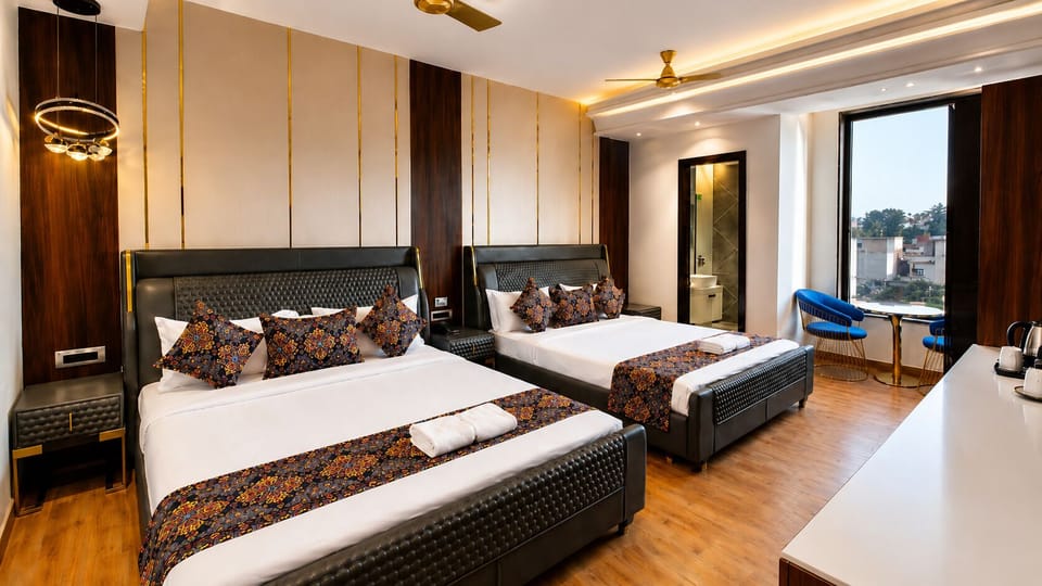Family Quadruple Room, City View | Desk, laptop workspace, iron/ironing board (on request), WiFi (free)