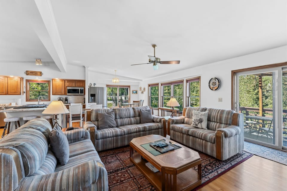 Picture yourself unwinding in this bright, open-concept living space where natural light pours through expansive windows.