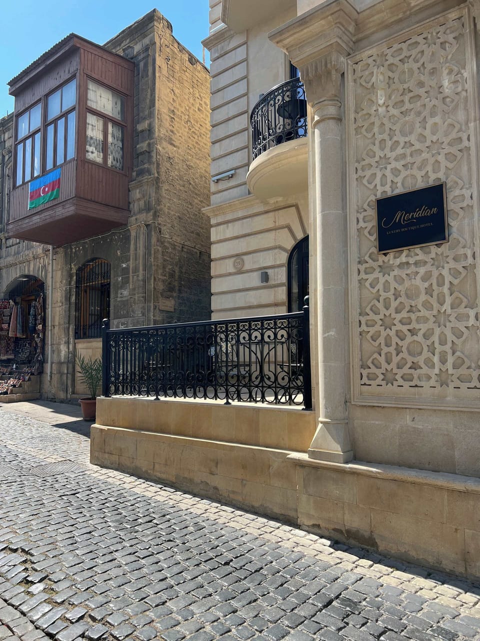Old City street approach near the apartment entrance.