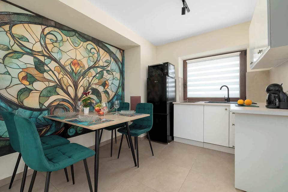 The sleek design of the kitchenette blending seamlessly with the living area.
