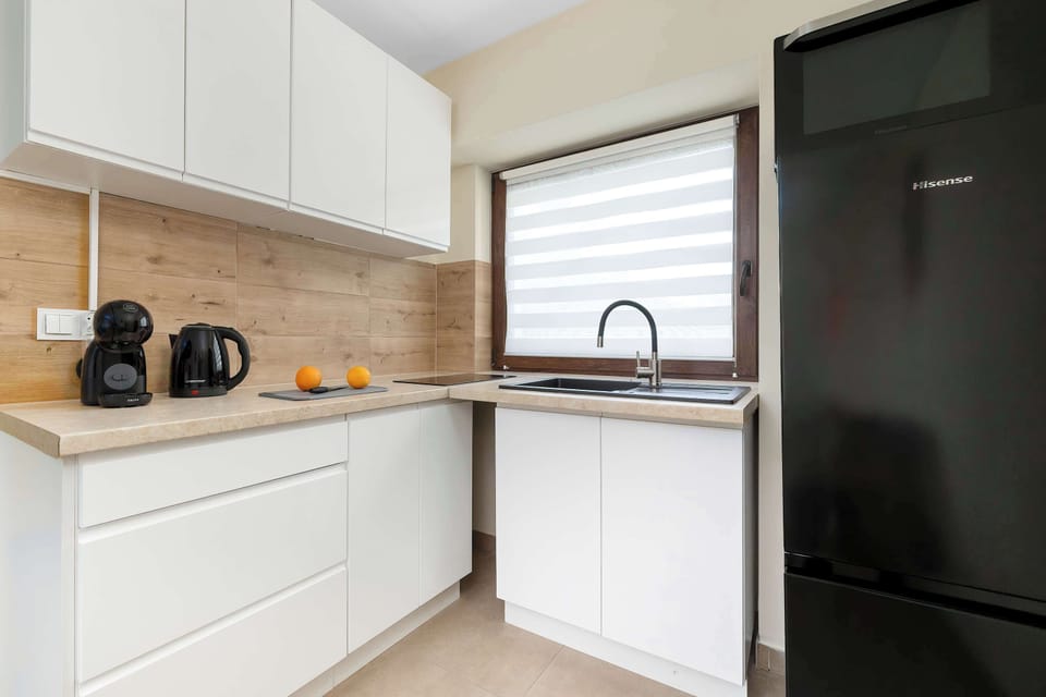 The fully equipped kitchenette includes everything you need for a home-cooked meal.