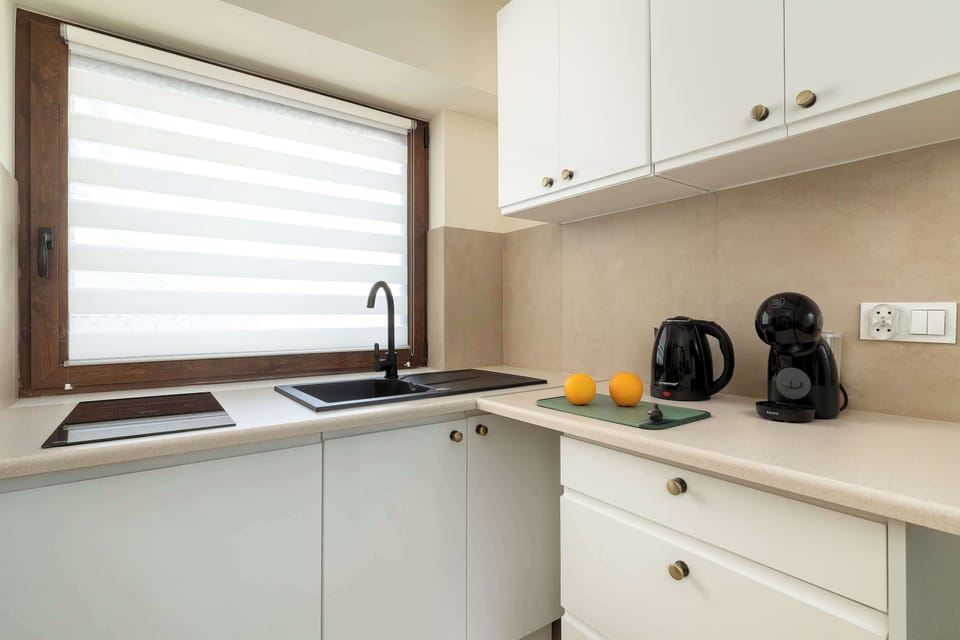The kitchenette's practical layout maximizes space and functionality.