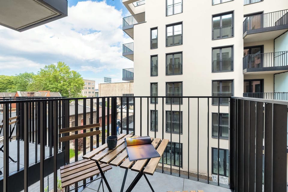 The balcony's stylish design ensures a pleasant stay.