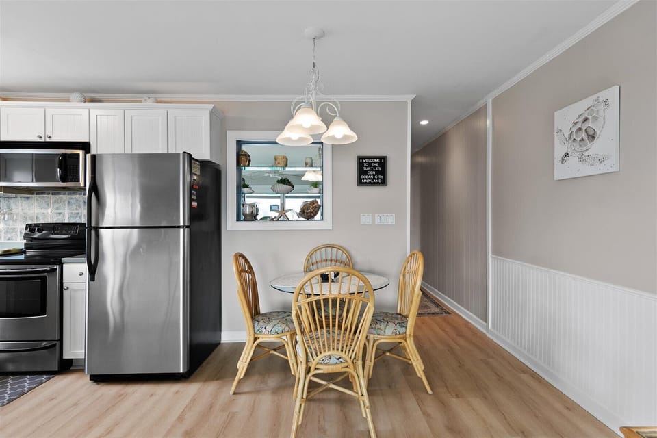 The dedicated dining area offers comfortable seating right next to the kitchen for effortless serving.