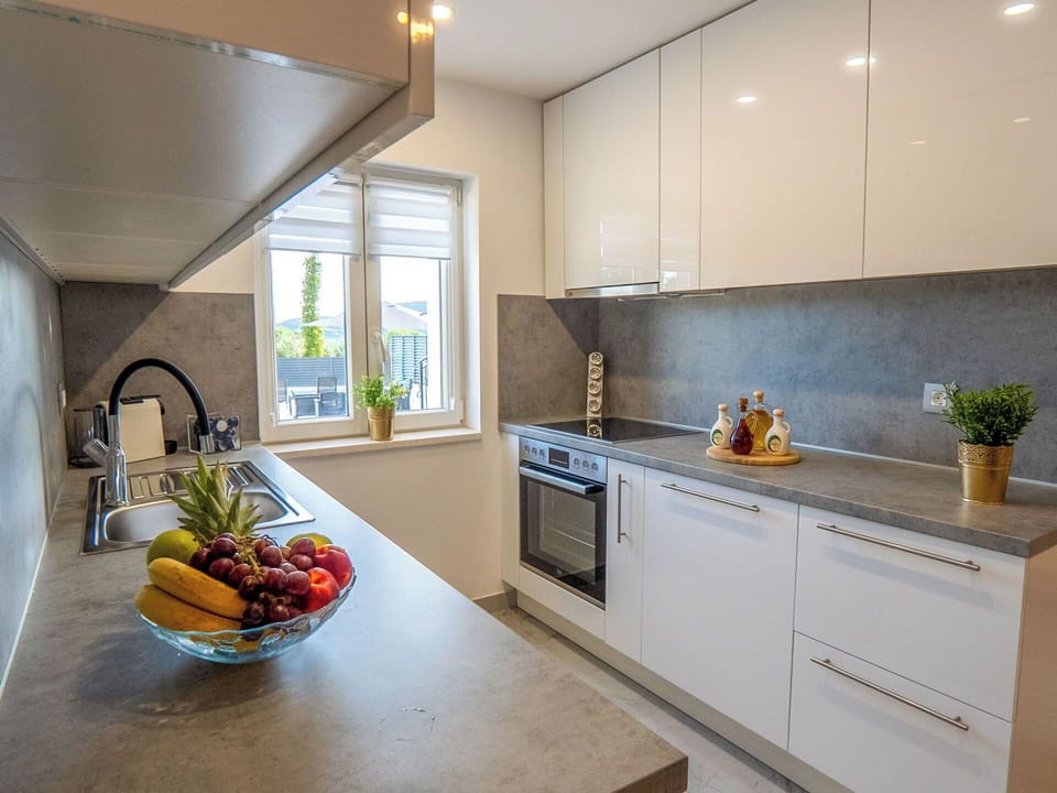 Countertop, Kitchen, Kitchen Appliance, Interior Design, Major Appliance, Flooring, Cabinetry, Home Appliance, Furniture, Wood