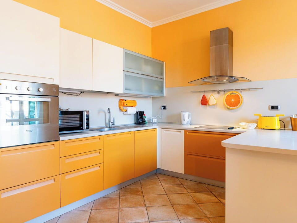 Kitchen, Countertop, Kitchen Appliance, Cabinetry, Major Appliance, Interior Design, Wood, Flooring, Yellow, Furniture