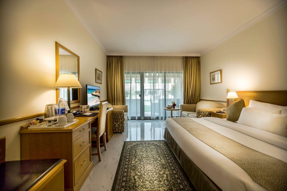 Standard Room, Multiple Beds | Minibar, in-room safe, desk, laptop workspace