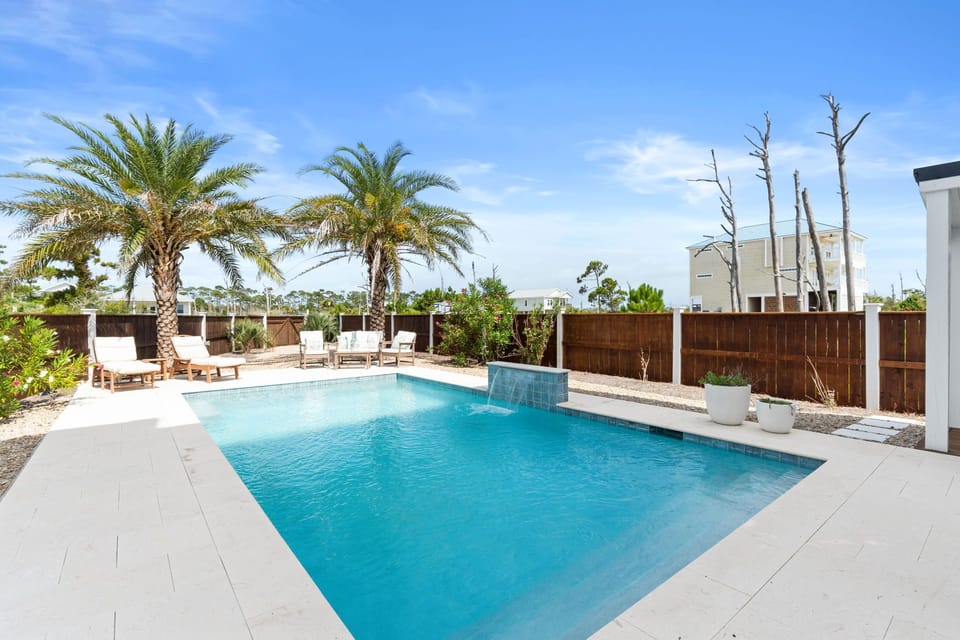 A sparkling private pool surrounded by swaying palms and sunny loungers awaits your Florida escape. Soak in the sun, take a refreshing dip, and unwind in your own tropical oasis.