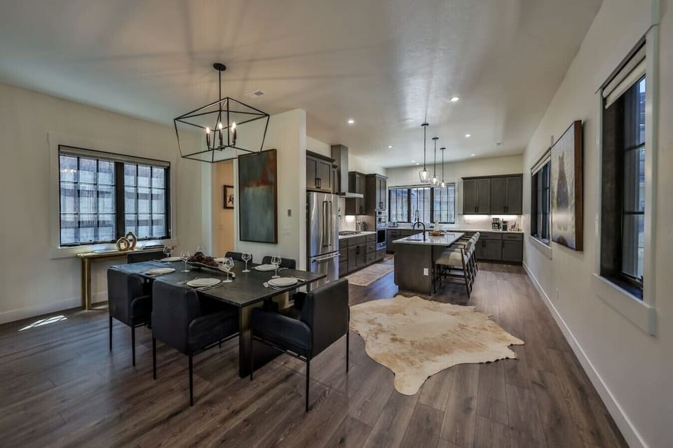 Open concept kitchen and dining room with 6 person dining table + bar seating