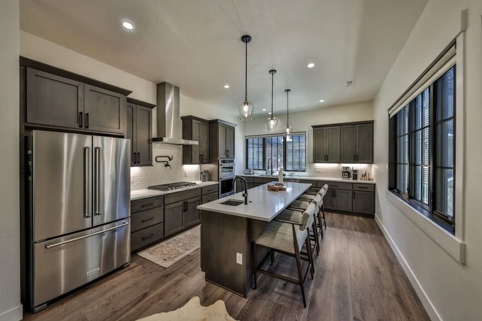 Gourmet kitchen with island and bar seating