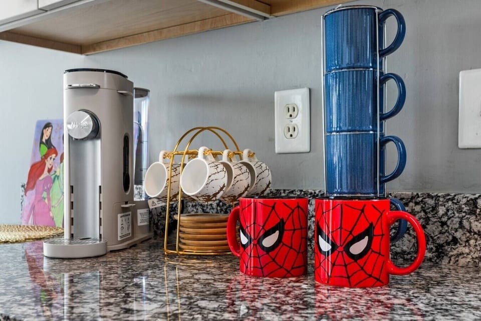 offee Bar to Start Your Day ☕🕷️ Wake up with your favorite brew! Enjoy our coffee station complete with a coffee maker, mugs, and a fun Marvel-inspired touch to kickstart your morning adventures.