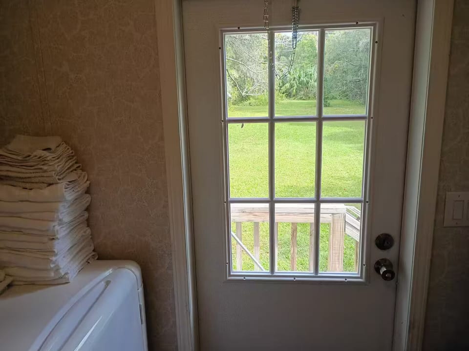 Laundry room with exit to back yard.
