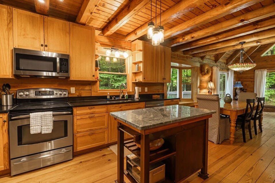 Kitchen | Granite Island & Stainless Steel Appliances | Natural Light