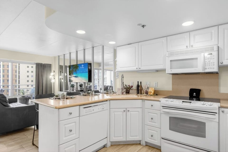 Fully equipped kitchen with modern appliances, ample counter space, and custom cabinetry. ILK-732