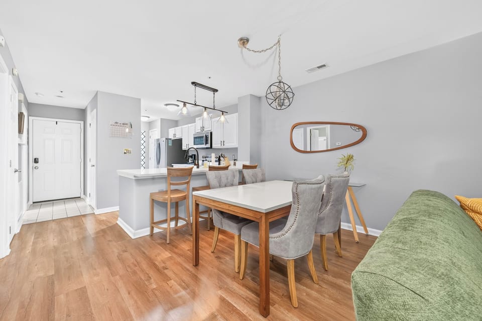 Among table with seating for 4 and additional seating at breakfast bar.