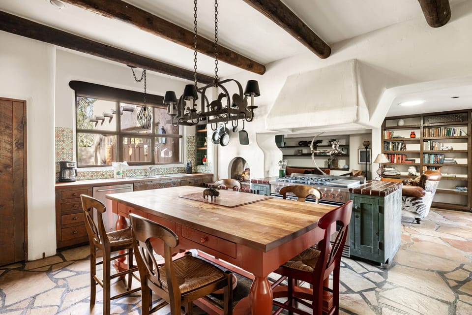 The open chef's kitchen offers generous prep space, premium appliances, and seamless flow into the home's living and dining areas.