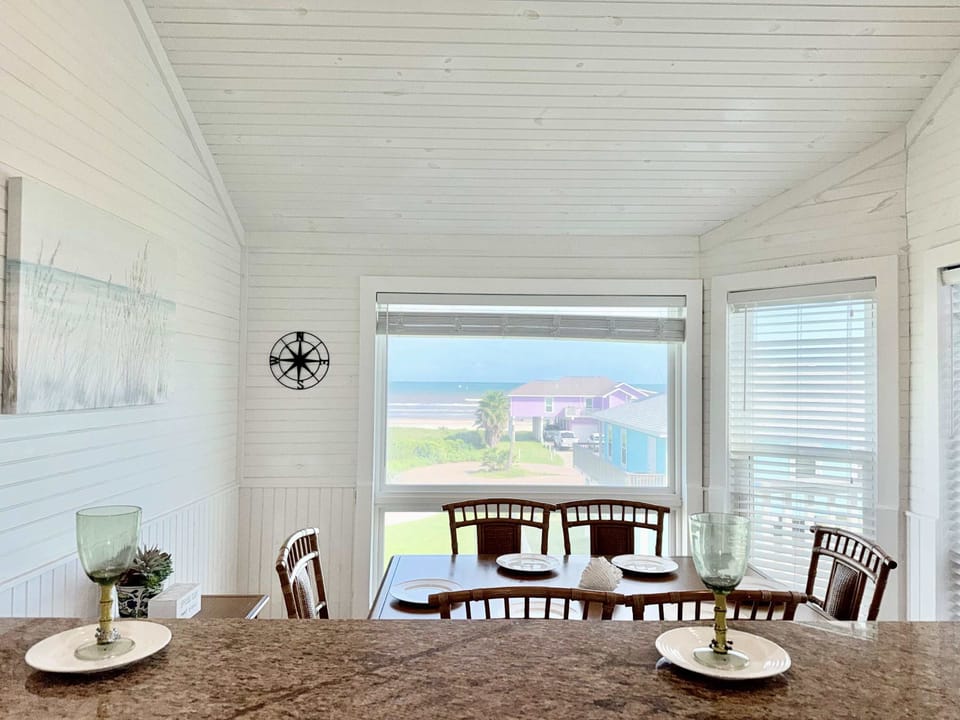 Share memorable meals and gathering in this dining space with ocean views.