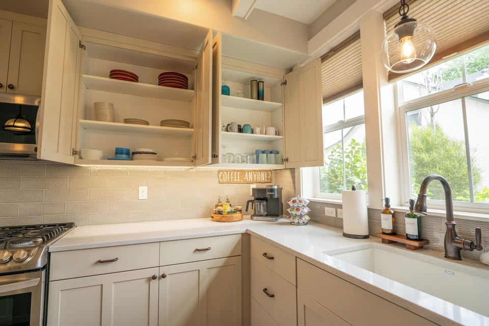 Bright farmhouse kitchen with sunny windows and a cozy coffee station