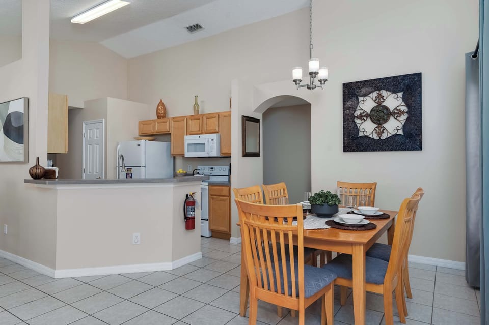 Compact kitchenette area w/ dining table just steps away.
