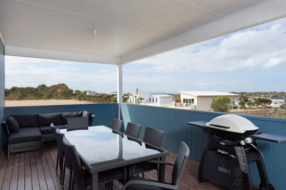 Balcony with outdoor furniture and BBQ set