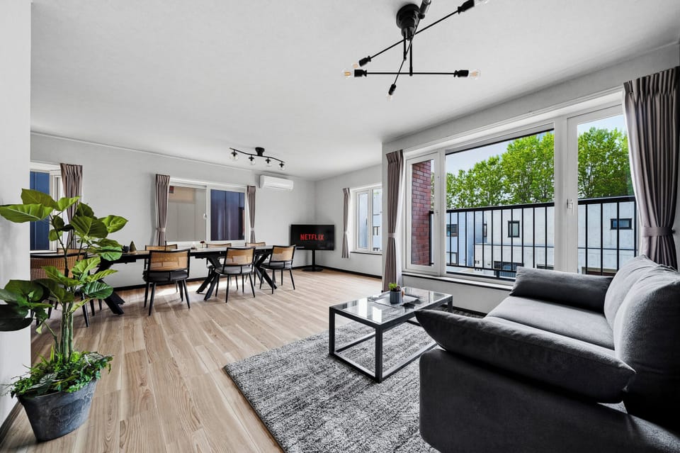 Apartment | Living area | 50-inch flat-screen TV with digital channels