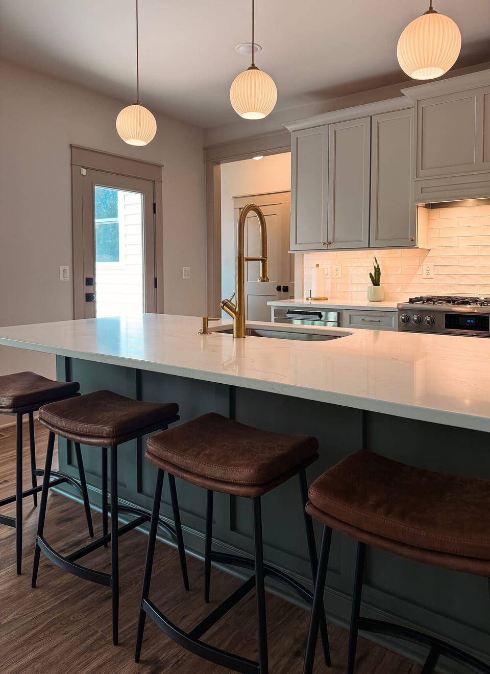 Stylish chef’s kitchen with oversized island seating for four