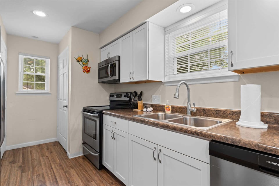 The open kitchen offers ample space & all the comforts of home​