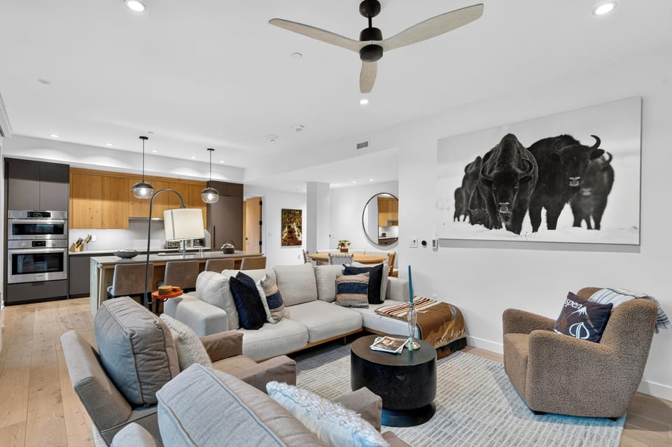 Effortlessly elegant and comfortable interiors blend living, dining, and kitchen areas.