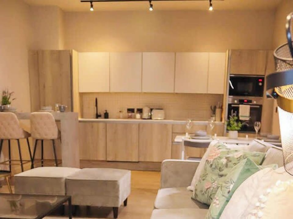 The heart of the home is the spacious open-plan living area, where the lounge, kitchen, and dining space come together. Relax on comfortable seating, enjoy your favorite shows on the Smart TV, or make use of the two sofa beds for extra guests.