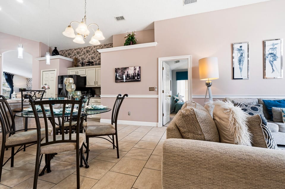 Enjoy the spacious open-plan layout connecting the living room, dining area, and kitchen—perfect for spending quality time together during your Orlando vacation.