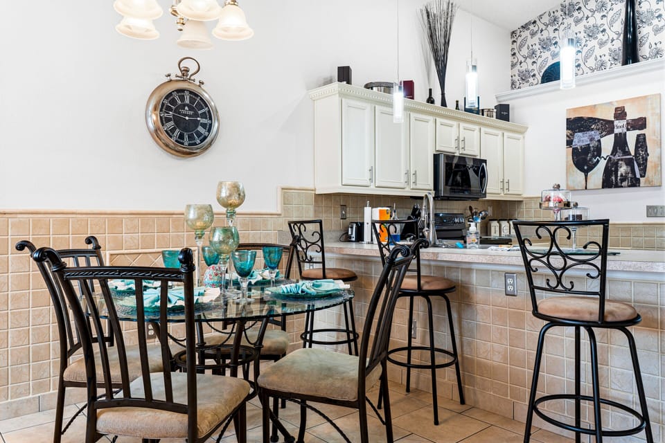 Enjoy the spacious open-plan layout connecting the living room, dining area, and kitchen—perfect for spending quality time together during your Orlando vacation.