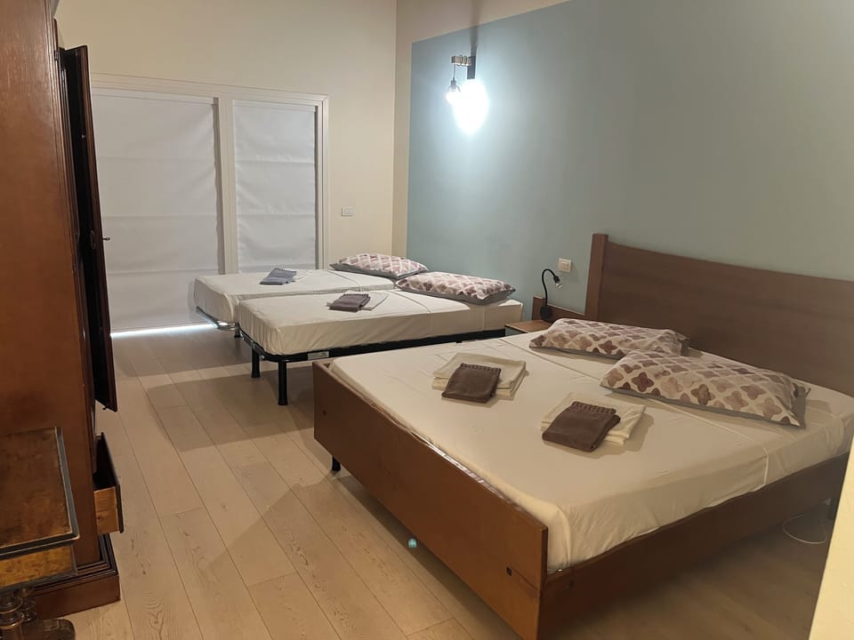 Comfort Quadruple Room, Garden View | Desk, blackout drapes, iron/ironing board (on request), WiFi (free)