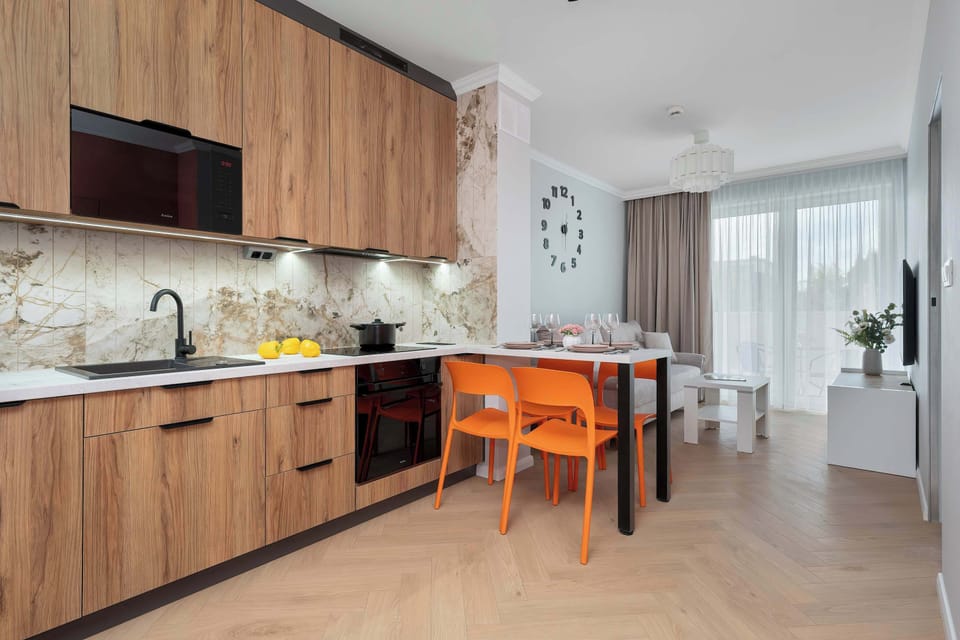 Wide-angle view of the kitchen and dining area designed for comfortable self-catering stays.