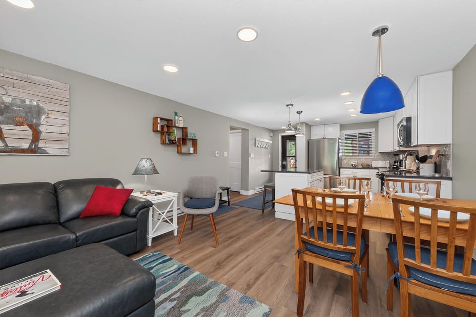Relax in your bright, open-concept space where the living room flows into a fully equipped kitchen and dining area—perfect for unwinding or sharing meals together.